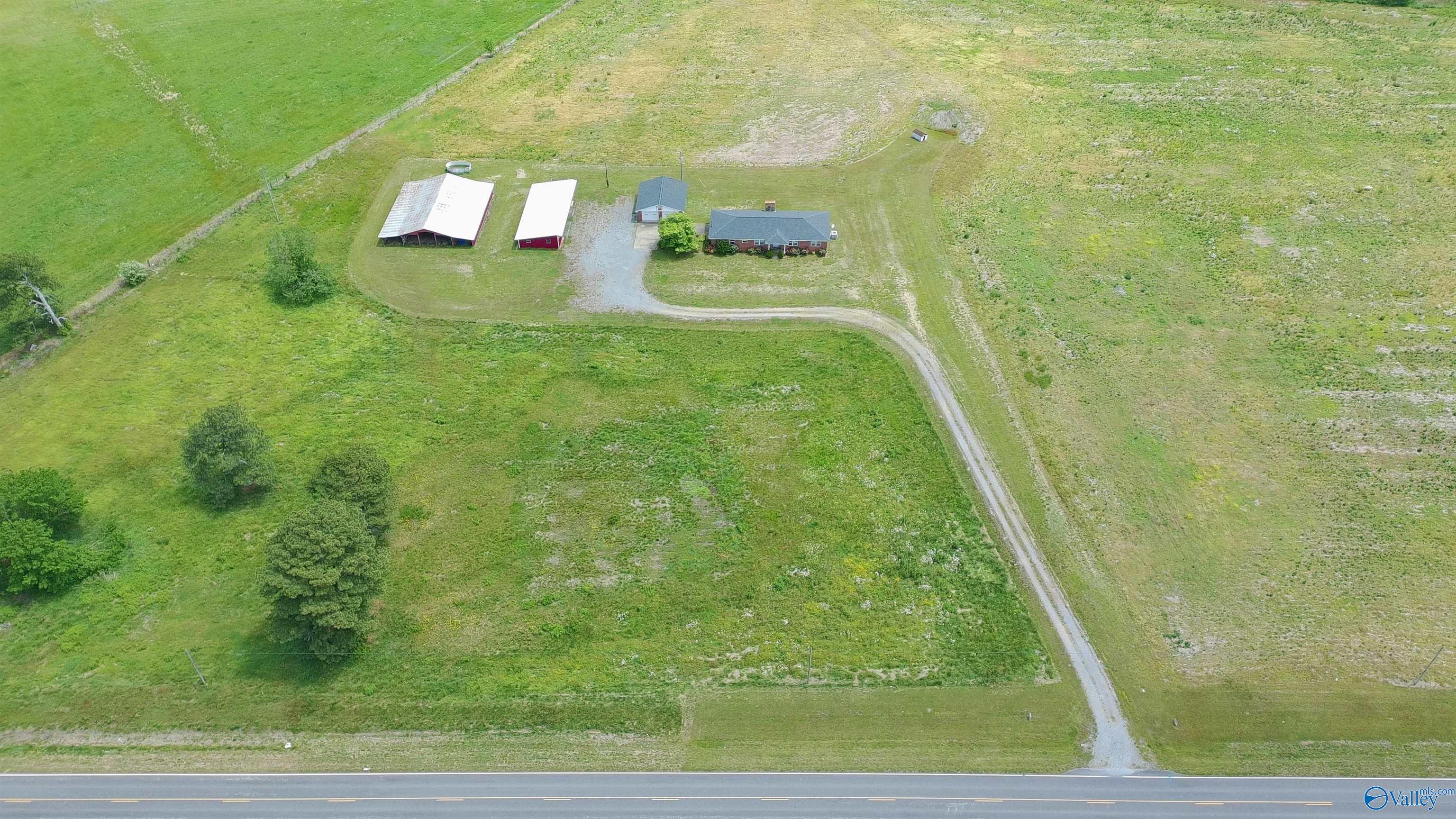 Barn closest to house is included.  Second barn is not included