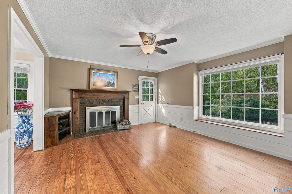 Living room with wood floors and fireplace