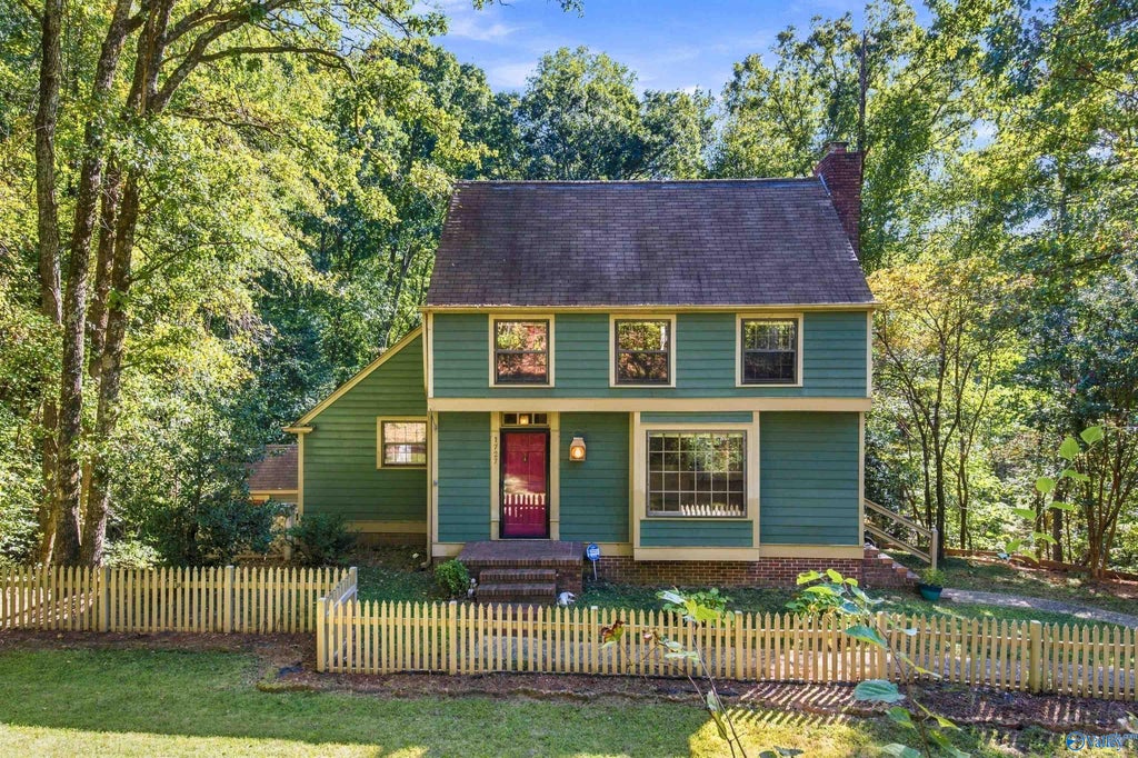 Front of 1727 Chestnut Mountain Road, a two-story home on a wooded lot