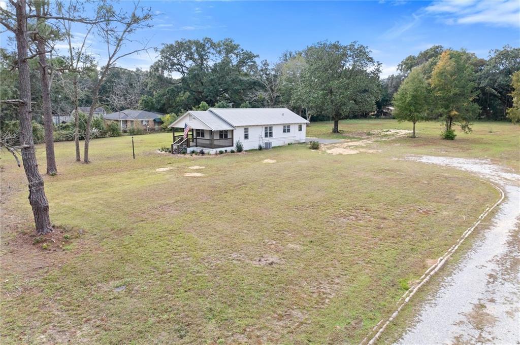 View of house from Lot 1 (not for sale at this time). Driveway you see is old driveway for the house and belongs to Lot 1 only (no longer used for lot 2 with house).