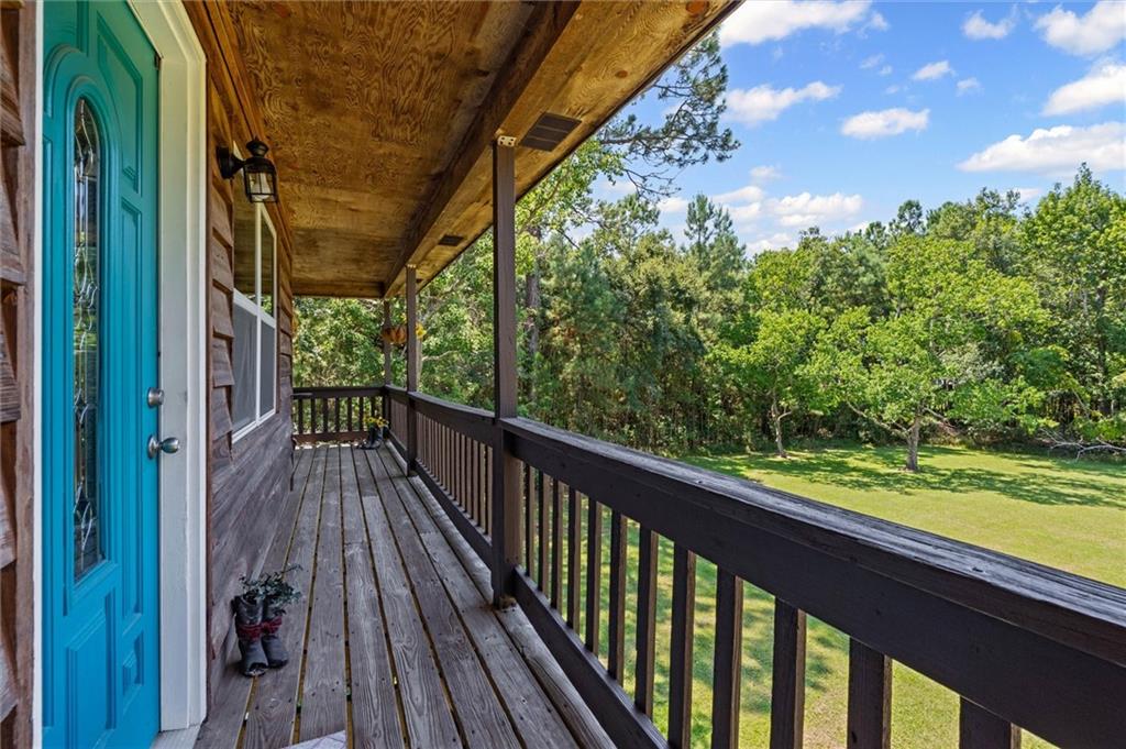 Wooden terrace with view of scattered trees