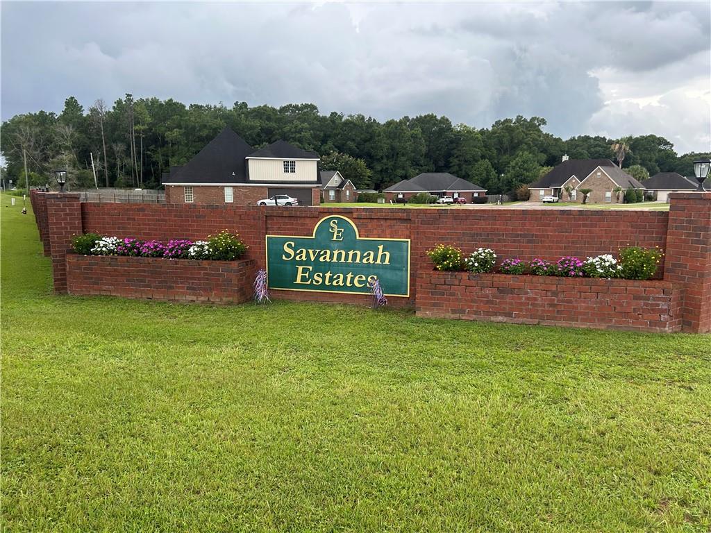Community sign with a lawn