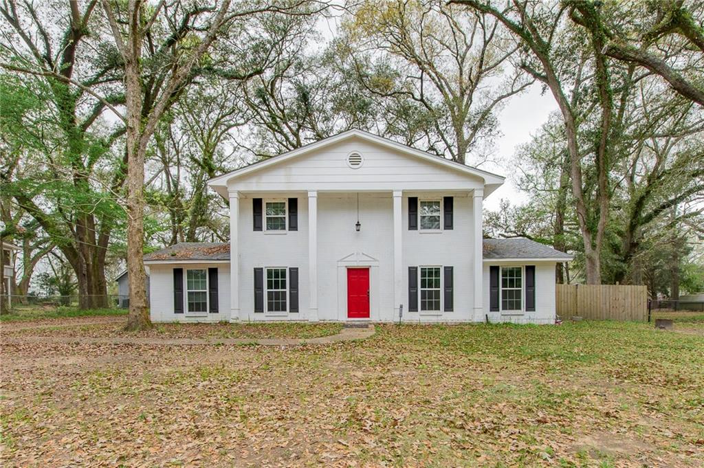 Greek revival inspired property featuring covered porch