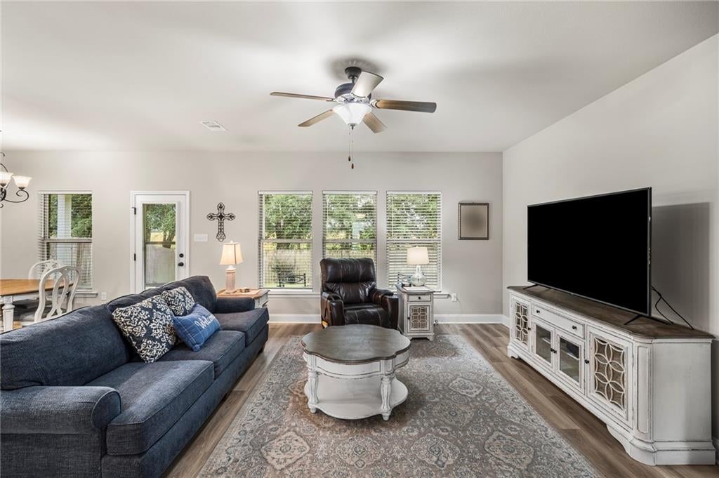 Bright living area with wood-finish flooring
