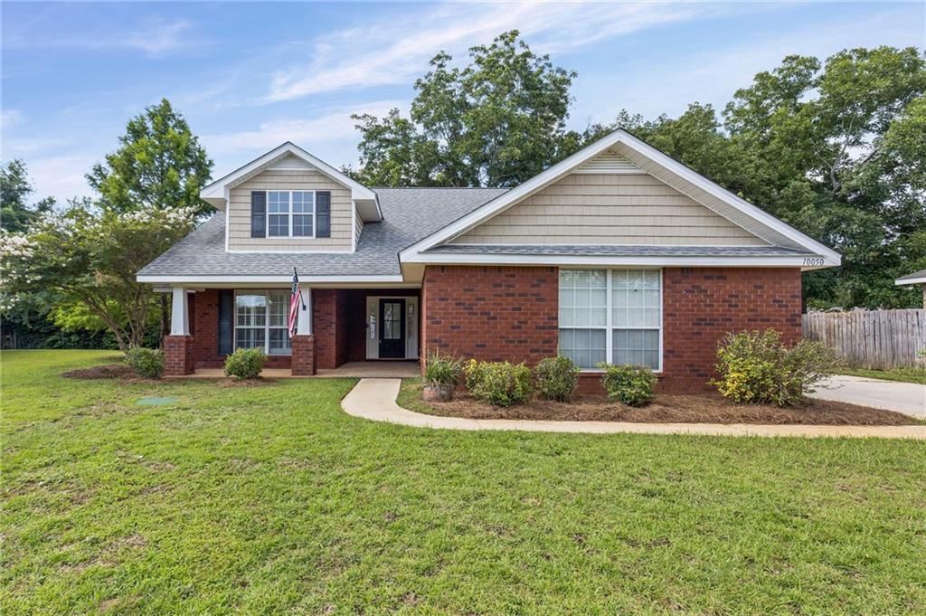 Brick exterior with a covered porch entry