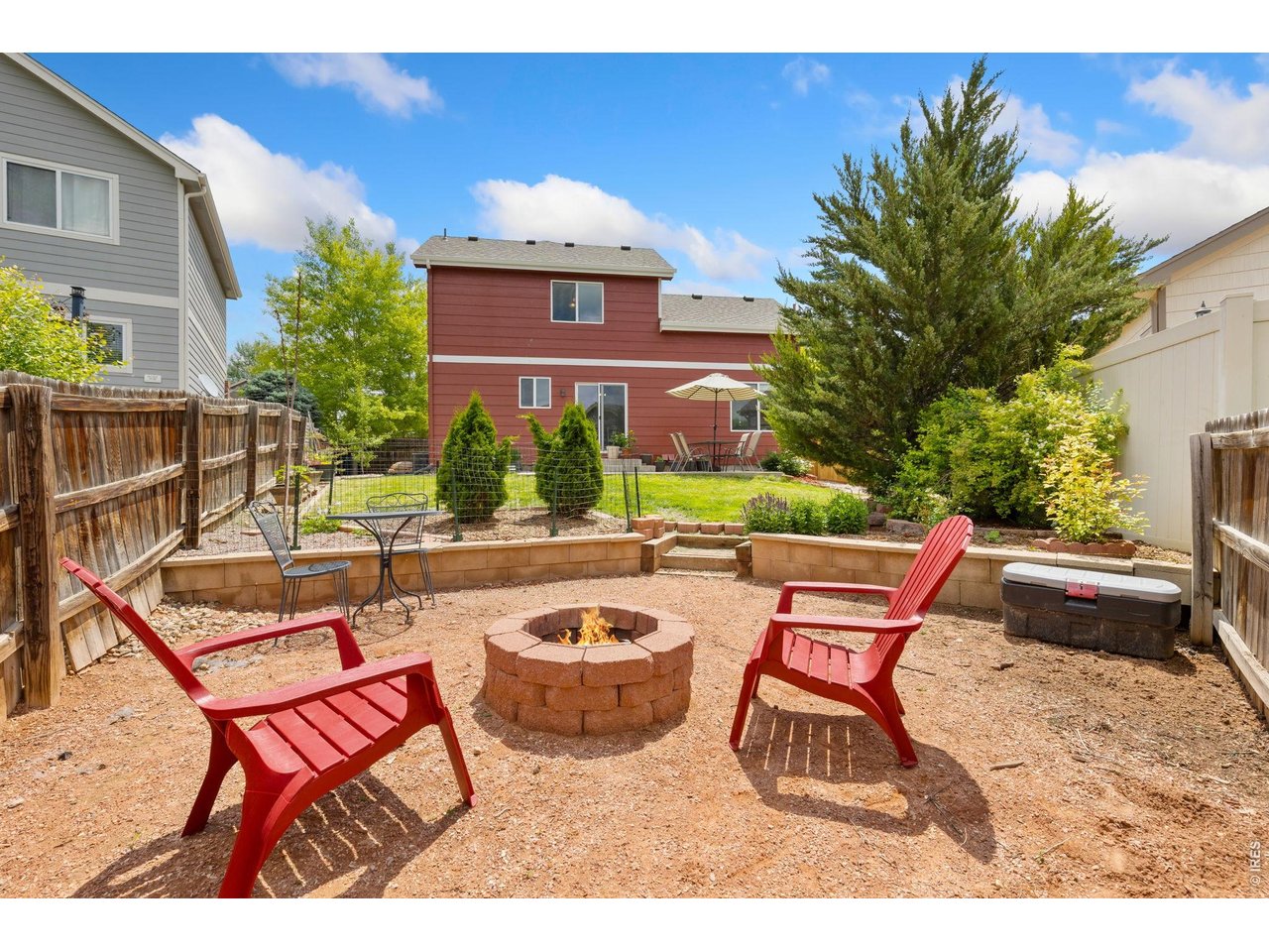 Enjoy summer nights around the firepit in this fully fenced backyard.