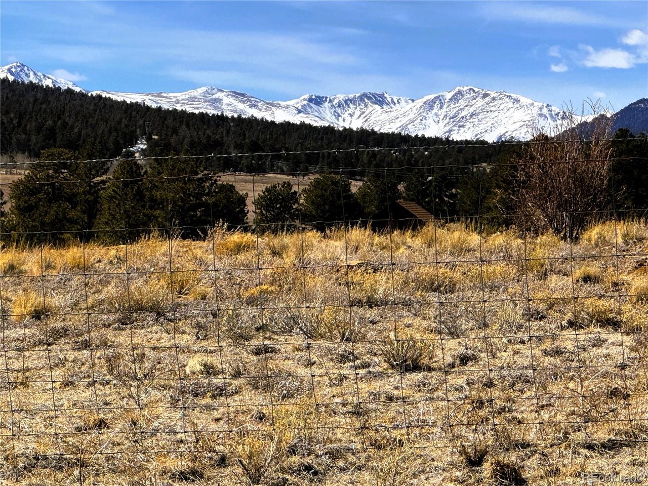 Zoomed view southwest from the property to the snow capped Collegiate Peaks