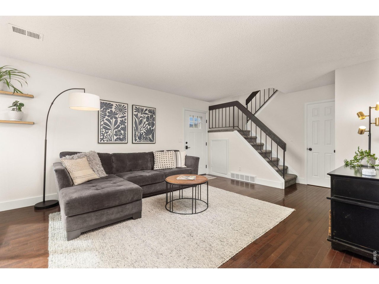 VIEW TO FRONT DOOR AND STAIRWELL