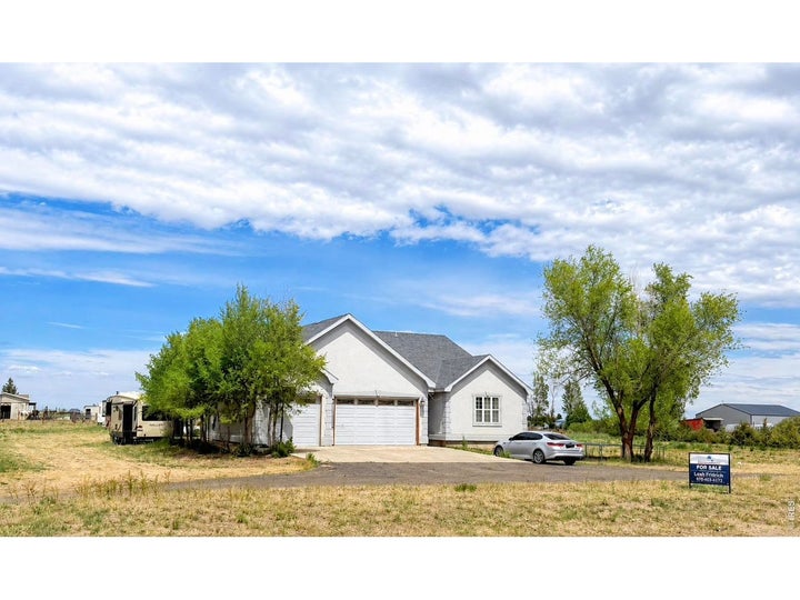 Photo 1 of 22 — 419 E 3rd Ave, Wiggins, CO 80654