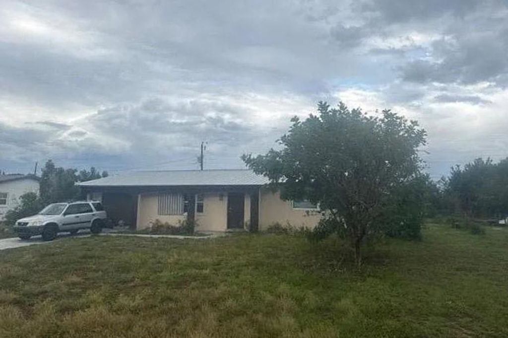 Photo of 331 S Hazelwood Avenue, Other Florida, FL 33936 (MLS # 400791)