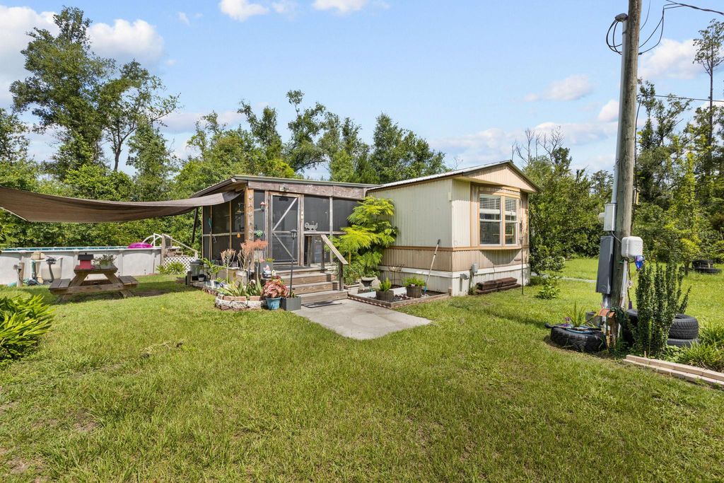 Photo of 1521 T W WILSON RD RD, Perry, FL 32347 (MLS # 401642)