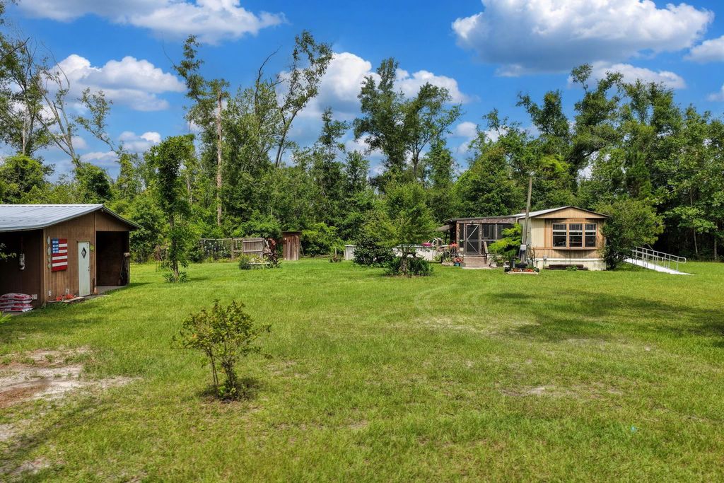 Photo of 1521 T W WILSON RD RD, Perry, FL 32347 (MLS # 401642)
