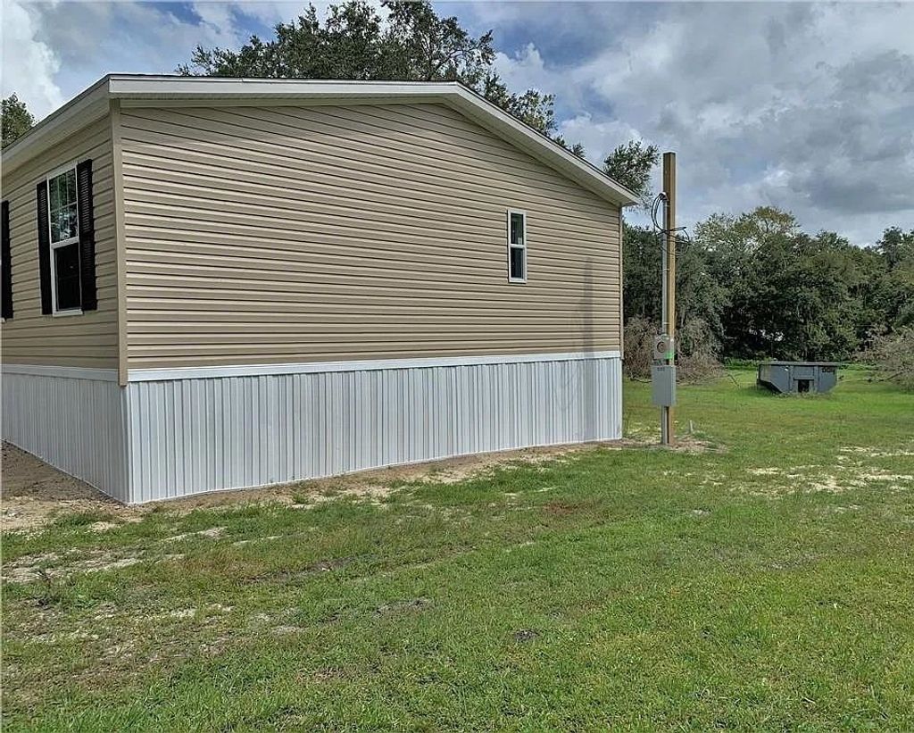 Photo of 6102 Woodhaven Drive, Other Florida, FL 33811 (MLS # 394156)