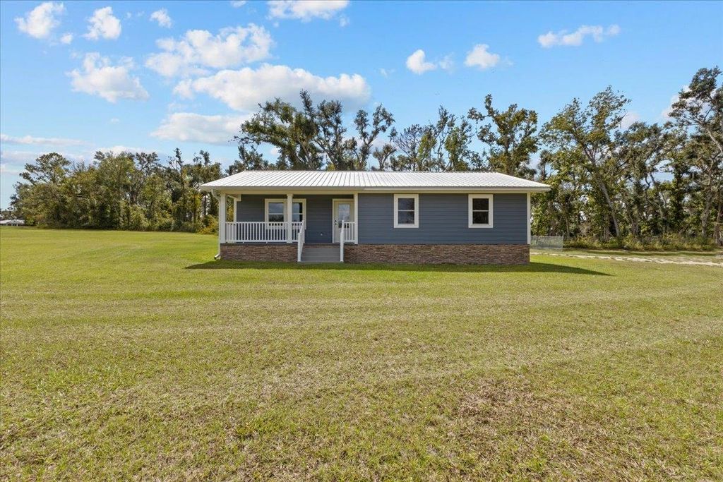 Photo of 647 SE Regency Trail, Madison, FL 32340 (MLS # 392076)