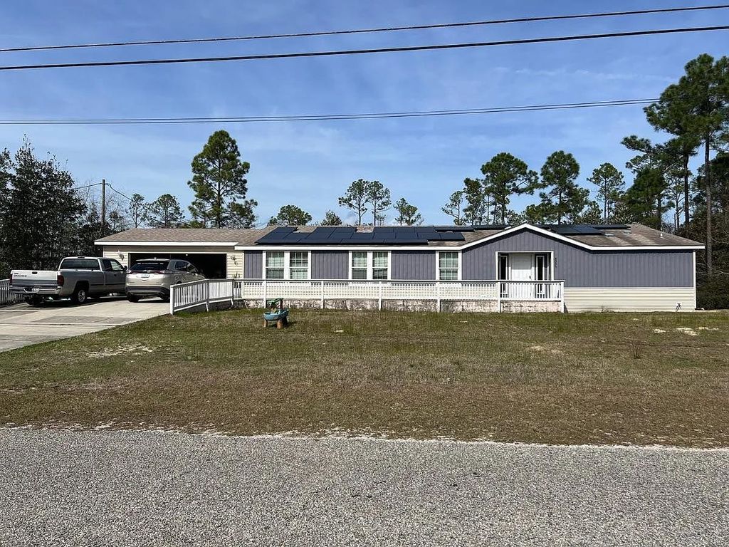 Photo of 8556 Bay River Road, Other Florida, FL 32566 (MLS # 397421)
