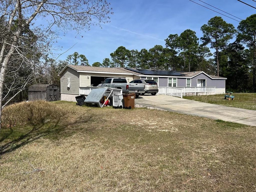 Photo of 8556 Bay River Road, Other Florida, FL 32566 (MLS # 397421)
