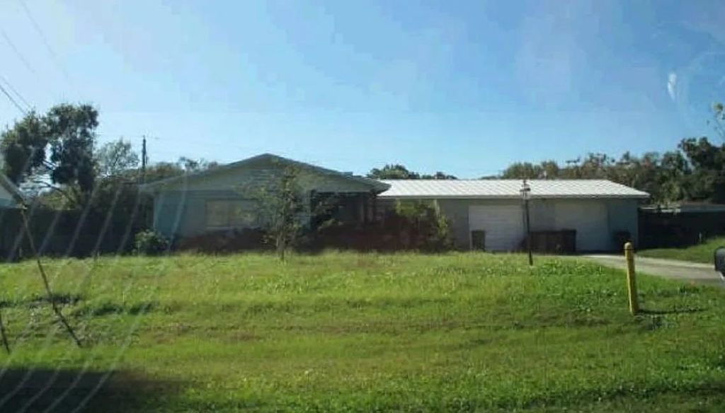 Photo of 1315 Parkland Boulevard, Other Florida, FL 34982 (MLS # 399194)