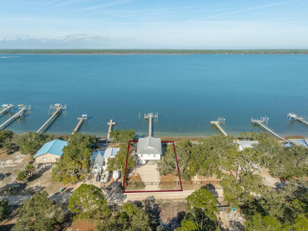 Photo of 203 Harbor Circle, Alligator Point, FL 32346 (MLS # 394815)