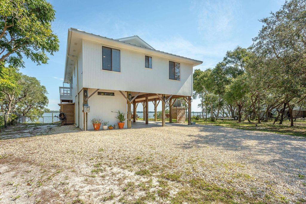 Photo of 203 Harbor Circle, Alligator Point, FL 32346 (MLS # 394815)