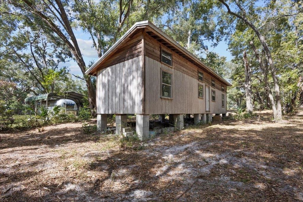 Photo of 7619 Canal Avenue, Fanning Springs, FL 32693 (MLS # 392424)