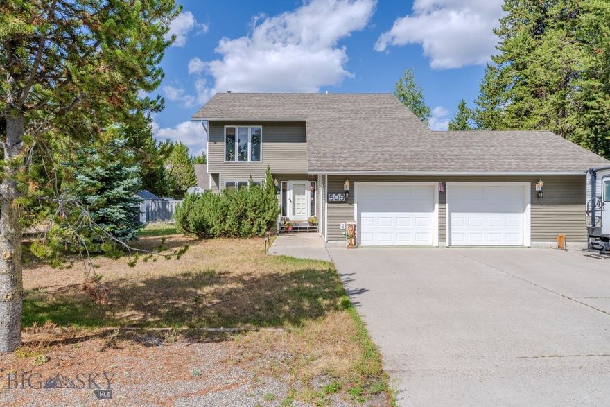 Welcome to 509 Gallatin Avenue, a spacious and well-maintained 4 bedroom, 2.5 bath home in the heart of West Yellowstone. This 2,000 square foot residence blends comfort, durability, and functionality with the unmatched access to outdoor adventure that makes this community so desirable. Set on a quiet street in the Madison Addition subdivision it offers close proximity to everything this beautiful area has to offer.

The home features a practical two-story design with inviting living spaces, including a cozy family room complete with fireplace, ideal for relaxing after a day of exploring. With a total of four bedrooms, there’s plenty of space for family, guests, or even a home office. An attached two-car garage provides parking and room for all your recreational gear. The home has been thoughtfully updated with all-weather siding and Trex decking, offering low-maintenance convenience and lasting curb appeal.

Beyond the home itself, the location is hard to beat. Nestled in a family-friendly neighborhood, this property places you just minutes from the West Entrance to Yellowstone National Park. Imagine the ease of access to some of the world’s most iconic landscapes, from geothermal wonders to abundant wildlife. The Greater Yellowstone Area is a true four-season playground: in summer, enjoy hiking, biking, and fishing; in fall, watch wildlife migrations unfold; in winter, take advantage of the area’s renowned snowmobiling and cross-country skiing trails; and in spring, explore uncrowded trails and fresh mountain air.

West Yellowstone itself is a welcoming, close-knit community. Residents enjoy local dining, unique shops, and the convenience of a nearby school—all with the charm of a small town surrounded by national forest and parkland. Whether you’re seeking a year-round residence or seasonal retreat this home provides the perfect balance of comfort, durability, and location.

509 Gallatin Avenue offers not only a home, but also an unparalleled lifestyle at the gateway to America’s first national park. Here, adventure begins right outside your door.