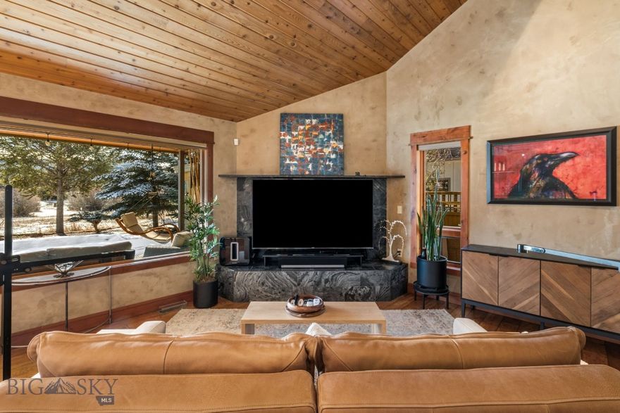 Discover your Montana dream home in Big Sky’s Meadow Village, where an open design with intimate spaces meets a prime location.  This inviting 4 bedroom, 3.5 bath home offers main level living with cathedral ceilings and expansive windows, flooding the living area with natural light and capturing beautiful mountain and meadow views. The upper level features a den and sitting room, providing a versatile space perfect for remote work or relaxation.  Enjoy the warmth of the wood stove in the main level sitting area, as well as electric wall mounted "fireplaces", throughout the home. Lounge on your private deck which overlooks the golf course area and community walking path that transforms into a groomed cross-country trail in winter.  Ample storage, a quiet setting, and a home that has never been rented add to its appeal.  Two master bedrooms offer comfort and privacy, while the remaining bedrooms are currently used as an office and exercise room.  The home has been meticulously maintained with attention to detail, including a primary bedroom addition completed in 2006.  It has been thoughtfully updated to enhance both style and functionality.  The home’s airy and open feel is enhanced by its incredible location—just moments away from Meadow Village, Town Center, a golf course, cross-country skiing, recreational spaces, community parks, local restaurants, and the scenic Gallatin River.  Outdoor enthusiasts will love the short distance to Big Sky’s Mountain Village Ski Resort and the wonders of Yellowstone National Park, less than an hour away. Enjoy summer strolls and savor the quiet setting that makes this home a peaceful retreat all year round.  Experience the perfect blend of comfort, convenience, and Montana beauty in this Meadow Village haven. Sold furnished.  Schedule your tour today.