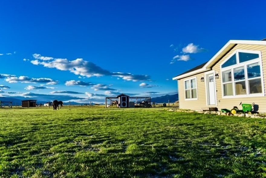 This is more than just a property — it’s a lifestyle. Welcome to your dream retreat nestled at the foot of the jaw-dropping Pioneer Mountain Range, where stunning views, wide-open skies, and endless possibilities come standard.

Set on nearly 24 acres of fully perimeter-fenced and cross-fenced land, this property is built for those who crave space, freedom, and connection to the outdoors. With four separate pastures, automatic waterers, and room to roam, it’s fully equipped for horses, cattle, or any large animals you love.

The main residence is a modern, light-filled 3-bedroom, 2-bath modular home with a smart, open floor plan designed for both comfort and function. Large windows bring the outside in, offering views that will stop you in your tracks. The kitchen boasts generous counter space and a massive walk-in pantry — perfect for prepping, storing, or even canning your own garden harvest.

Need space for family, guests, or income potential? The detached guest house delivers big value with 2 bedrooms, 1 full bath, a cozy living area, its own laundry, and an attached 2-car garage — ideal for multigenerational living, AirBnB, or a private rental.

Love to grow your own food? The thriving greenhouse and established garden area will blow you away — an oasis for green thumbs and homesteaders alike.

And when adventure calls? You’re just minutes from Forest Service access, with endless trails, hiking, and riding terrain right at your doorstep.

Whether you're dreaming of a mini-ranch, mountain retreat, or full-blown hobby farm, this property has the infrastructure, location, and views that truly set it apart.

?? Serene. Self-sufficient. Scenic beyond belief.
?? Don’t miss your chance to own a slice of paradise.

Schedule your private showing today — properties like this don’t come around often.