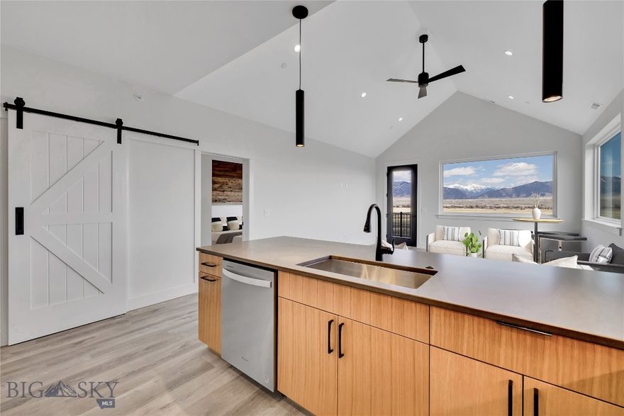 Set against the wide-open landscapes and river corridors that define the Madison Valley, The Drift at North Forty offers a rare opportunity to own new construction in the heart of Ennis. Located within walking distance of Main Street and minutes from the Madison River, these 3-bedroom, 2-bathroom residences provide immediate access to both town and open country. Each home is designed for low-maintenance living with an open-concept layout and expansive windows that frame mountain views and fill the space with natural light. Finishes are durable and clean, designed with a timeless aesthetic that complements the surrounding landscape. The interiors balance practicality and comfort, making the home equally suited for everyday living and extended stays. The walkout primary suite offers privacy and direct outdoor access, while two additional bedrooms allow flexibility for guests, family, or a home office. An attached one-car garage provides protected parking, and the dedicated storage room offers additional flexibility for fly tying, workout equipment, a small home gym, or organized gear storage. Upper-level residences benefit from elevated sightlines and broader valley views. Short-term rentals are permitted, offering owners the option to enjoy the property personally while maintaining income flexibility. World-class fly fishing on the Madison River, hunting and hiking on nearby public lands, and skiing at Big Sky Resort are all within easy reach. Yellowstone National Park and Bozeman Yellowstone International Airport are approximately an hour away, making The Drift at North Forty a well-positioned base for year-round use in the Madison Valley.