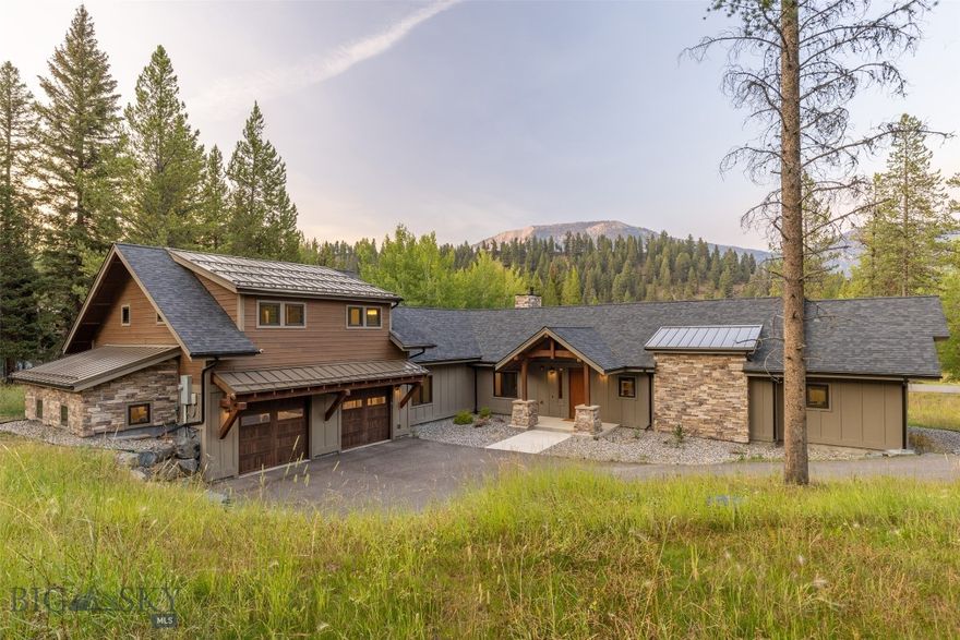 Welcome to 17 Nordic Lane, a striking mountain retreat in the coveted Aspen Groves neighborhood of Big Sky. Designed by Stillwater Architects and built in 2019 by Biggerstaff + Co., this 4-bedroom, 4-bath residence spans 3,440 square feet on nearly an acre of wooded land. With just one owner and meticulous care, the home blends high-end finishes, efficient design, and timeless mountain-modern style.

Nestled among the trees, this property offers both privacy and a neighborhood feel, with quiet streets ideal for walking or biking. From the expansive picture window, mornings begin with breathtaking sunrises over the mountains—perfectly enjoyed with a cup of coffee from the living room sofa. In the evenings, the back patio and outdoor fireplace set the stage for entertaining, stargazing, or the occasional wildlife sighting.

Inside, a thoughtfully designed layout balances connection and privacy. The primary suite is separated from the two upper bedrooms, creating an ideal setup for guests or family. A flexible bonus room off the living area provides space for an office, workout room, or additional bedroom. The chef’s kitchen, anchored by a generous island, is a favorite gathering space for entertaining, while large windows throughout frame the surrounding forest and flood the home with natural light.

With forced air, A/C rough-in, a humidification system, two propane fireplaces, a wood burning fireplace on the back patio and like-new condition thanks to careful use, the home is move-in ready.

Just minutes from Big Sky Town Center and Big Sky Resort, the location is unmatched—direct trail access means hiking, cross-country skiing, and biking are right outside your door, while world-class downhill skiing is only 8–10 minutes away. Year-round, Big Sky offers unmatched recreation, from summer concerts and farmers’ markets to snowshoeing, tennis, and unparalleled skiing.

Rarely does a property like this come to market in established Aspen Groves — one that so seamlessly combines mountain privacy, neighborhood warmth, and modern comfort. 17 Nordic Lane is more than a home; it’s a basecamp for everything Big Sky has to offer.