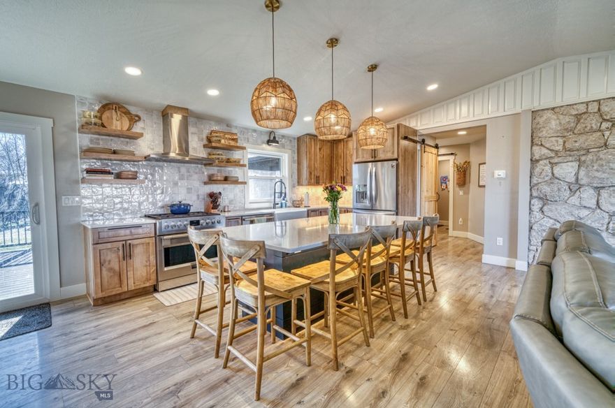 Welcome to this beautifully updated 5-bedroom, 3-bathroom home in the heart of Three Forks, just 30 minutes from Bozeman! Perfectly situated across from the elementary school, this single-family home offers both convenience and comfort. Step inside to discover a newly renovated kitchen featuring quartz countertops, a large island perfect for entertaining, a new 36" upgraded gas range and range hood, a large farmhouse sink, and custom tile backsplash that goes all the way up to the ceiling. The cozy living room with a gas fireplace invites you to relax and unwind. The main level boasts durable vinyl plank flooring throughout, a stunning brand-new master suite complete with a private bath showcasing custom tile work in the shower and an adjacent laundry room for added ease. Also on the main level, you will find a second bedroom and full bathroom plus an additional room that could be used as an office, bedroom or even a sunroom with great natural light! Downstairs, the finished basement offers three additional bedrooms (one being non-conforming), a full bathroom, a second laundry room, and a wood stove, creating a warm and inviting space. Outside, enjoy the large new back deck—ideal for summer barbecues—featuring hot tub hookups ready to go and custom lighting to set the mood. The fully fenced backyard offers privacy, and the garden is ready for your green thumb. A two-car garage adds convenience, and the thoughtful new addition makes this home even more functional. Don’t miss this incredible opportunity to own a move-in-ready home with modern updates and small-town charm. Schedule a showing today!