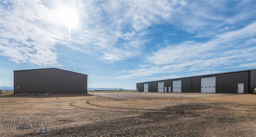 Exceptional investment opportunity featuring two industrial buildings situated on 2.77 acres, offering immediate income with strong upside potential. The property includes a total of 8 shop units (4 per building), each designed for functionality and durability with metal siding and roofing, 14’ overhead doors, and 19’ peak heights. Each unit is fully insulated with Corbond, separately metered, and equipped with private restroom, shower, and washer/dryer hookups. The layout and construction allow for a low-maintenance, hands-off investment with reliable cash flow. Included in the sale is an additional 3.96-acre parcel located directly north of the buildings, offering excellent potential for future development, expansion, or additional income-production. This is a rare chance to acquire a turn-key industrial investment with immediate returns and built-in growth opportunity in a central location.