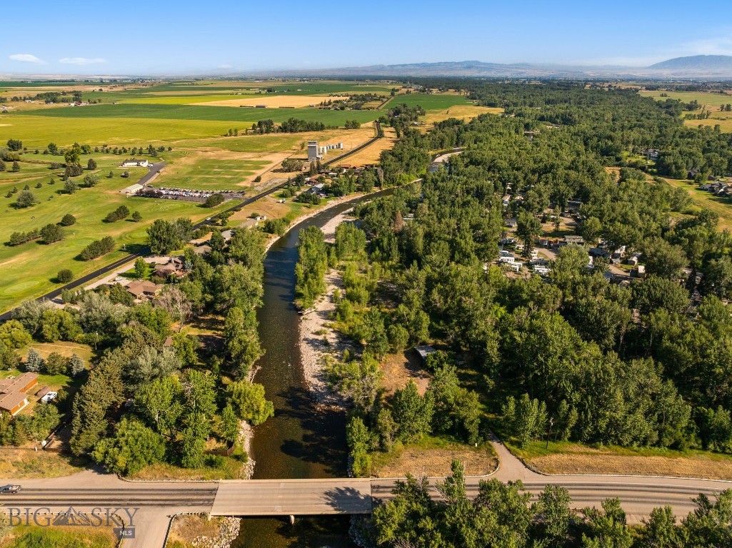 3.8 Acres on the Gallatin River with no Covenants or Restrictions! Build your dream home, commercial business, retreat, or recreate on this lush, private lot on the river. Power to lot and a half covered pavillion included on premises. Located just 9 miles from downtown Bozeman in the Four Corners area, this lot is close to everything, yet has the seclusion and privacy that is sought after by so many. Enjoy being minutes away from the Cottonwood Hills golf course for the days when the fish aren't biting or take a stroll through the peaceful the wooded lot. A location like this doesn't come along often so grab the opportunity while you still can!