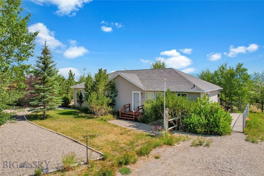 One of the BEST BUYS in the Madison Valley is this very well maintained 5 bedroom - 3 bath home on 6+ acres hidden in formally landscaped trees.  Beautiful views from the eastern deck of the mountains, wildflower garden, and trees.  Antelope are some of your main neighbors.  The house has an open floor plan with a propane stack rock fireplace as the focal point - especially on a winter's eve.  3 bedrooms on the main floor (current owner uses 2 of them as an office and workout rooms) and a large master En-suite with full bath (jacuzzi tub - check out the views! and shower), walk in closet, and private exit onto the eastern deck (perfect place for morning coffee or watching the as the sunset turns the Madison Mountains pink and purple with alpine glow.  The basement adds 2 more bedrooms, the 3rd bath, family room, and lots of storage.  The property is beautifully landscaped with mature trees, perennial flower beds, and green grass.  Fiber Optics gives you an opportunity to work from home.  Want horses?  Fence a pasture and bring them!  All of this is found less than 10 minutes from downtown Ennis, an hour's drive to Yellowstone National Park, or the Bozeman Airport.  Light covenants will allow for VRBO if that fits your lifestyle.  Priced to sell - it's a lot of home for your money!!