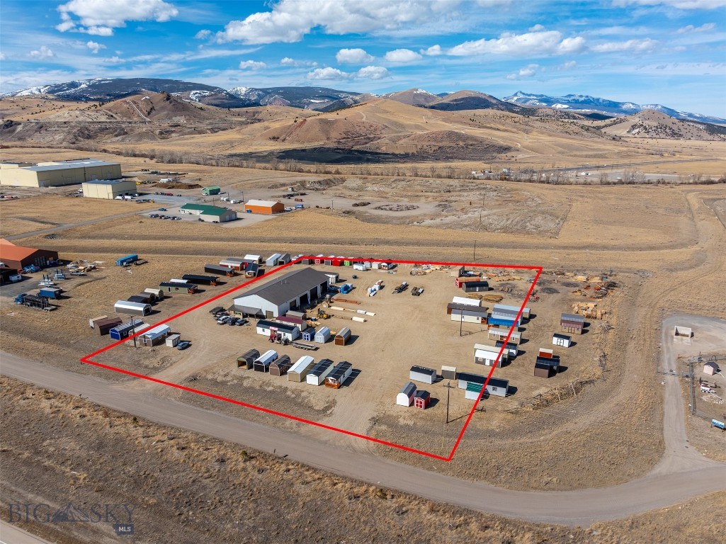 Located in Anaconda's Light Industrial Development District, this 7,200 sqft warehouse sits on 4.735 acres, offering a prime location for your business or next commercial investment opportunity. The warehouse is approximately 120x60ft, broken down into three primary sections with a total of six (6) commercial garage doors. On the far south-side section, you will find a private office, break room, full-bath & two additional rooms located upstairs. As you make your way through, you will enter the main warehouse area which includes four (4) commercial garage doors. The north-side of the warehouse features its own stall where the remaining two (2) commercial garage doors are located on the east & west side. Spray foam insulation throughout with 6000PSI concrete floor and an epoxy coating. Main heating source is fueled by propane with a mixture of infrared heaters & a forced air furnace with electric supplement heating in private office & break room/bathroom. On city water & city sewer. Site is located within close proximity to I-90.
