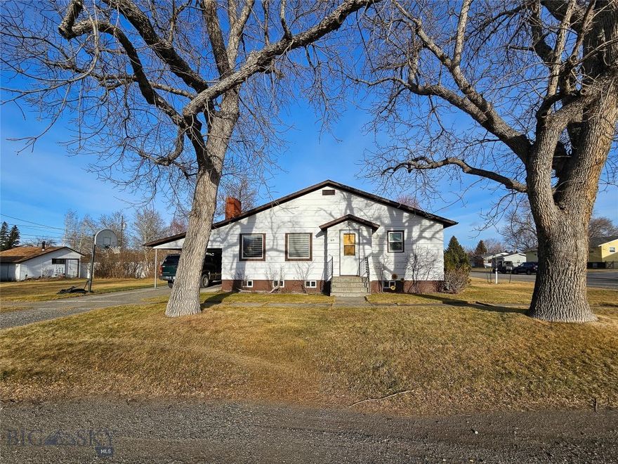 This well-maintained 4-bedroom, 2-bath home is located in a great residential neighborhood, just minutes from the grade school and city park. Situated on a spacious corner lot, there’s plenty of room to play, garden, or simply enjoy the outdoors.

The main level features a large, inviting living room and a kitchen with sliding glass doors that lead out to the deck—perfect for entertaining or relaxing. The dining room easily accommodates a large table, making it ideal for gatherings and family meals. The home offers excellent storage throughout and is ADA accessible for added convenience.

Downstairs, you’ll find a generous family room that provides additional living space, along with two bedrooms in the basement (note: these bedrooms do not have egress windows). A carport and storage shed add even more functionality and storage options.

With its flexible layout, ample storage, and prime location, this home offers comfort, space, and convenience for a variety of lifestyles