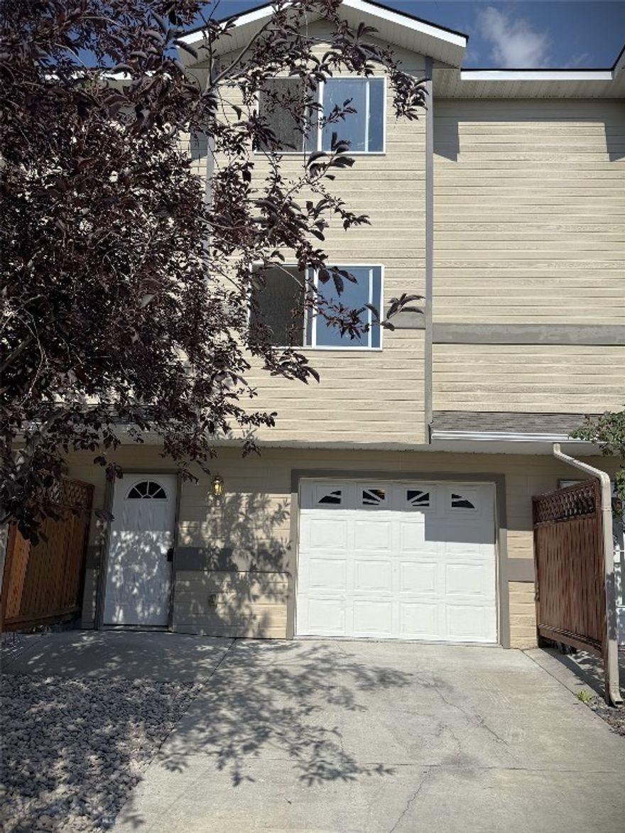 Clean and kept - ready to go!   Three levels offer ample living space in this R-panel constructed home, with very low utility bills.  The main floor is the heated garage with laundry area and storage.  2nd level is open living room, kitchen, 1/2 bath, and dining area - deck off kitchen.  3rd level is 2 spacious bedrooms and a full bath.  Bedrooms and living room offer great views.  So nice to pull into your attached, heated garage, and you're home.  Owners have painted and stained, new carpets on stairways, engineered flooring, epoxy paint on garage floor, new window treatments on order, cleaned professionally - it's fresh!  Two blocks form the newly (being constructed) Four Ranges Wellness Center that will include a membership to owner or a renter, if you choose to rent your home out!