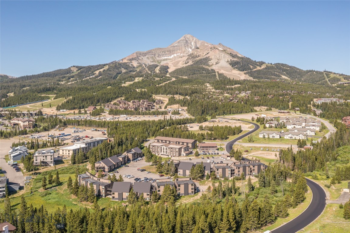 This beautifully remodeled one-bedroom Hill Condo offers comfort, function, and convenience all within 440 square feet of smartly designed space. With a bonus sleeping area, this cozy retreat comfortably sleeps four with a queen bed and a set of bunks—perfect for weekend getaways or rental potential.
Enjoy stunning Lone Peak views from your living space, plus thoughtful upgrades like stainless steel appliances, new cabinetry, an all-in-one washer/dryer, slate tile and recently carpeted floors. As a ground-floor unit, it offers easy access for walking your dog or hopping on the nearby Big Sky Resort skier shuttle.
Recent exterior renovations to the complex include new siding, roofs, windows, and doors—adding value and curb appeal to this move-in-ready mountain escape. Whether you're looking for a basecamp for adventure or a low-maintenance investment property, this condo checks all the boxes.