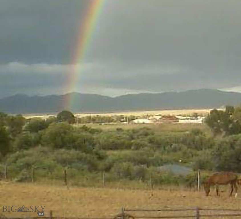 Modern Country living minutes from town! This property sits directly above the picturesque Beaverhead River, with vast views of the valley and surrounding mountains. This lot is located at the end of the road and has unlimited opportunities with NO COVENENTS! One side borders the West Bench Canal uniquely exhibiting two waterfront features. It is DEQ Approved for septic and well. There is power and fiber optic high-speed internet to the lot, and natural gas close by. Whatever your plans may be, this is the ideal spot to build your dream project, the options are endless. Possible Owner Financing option included!