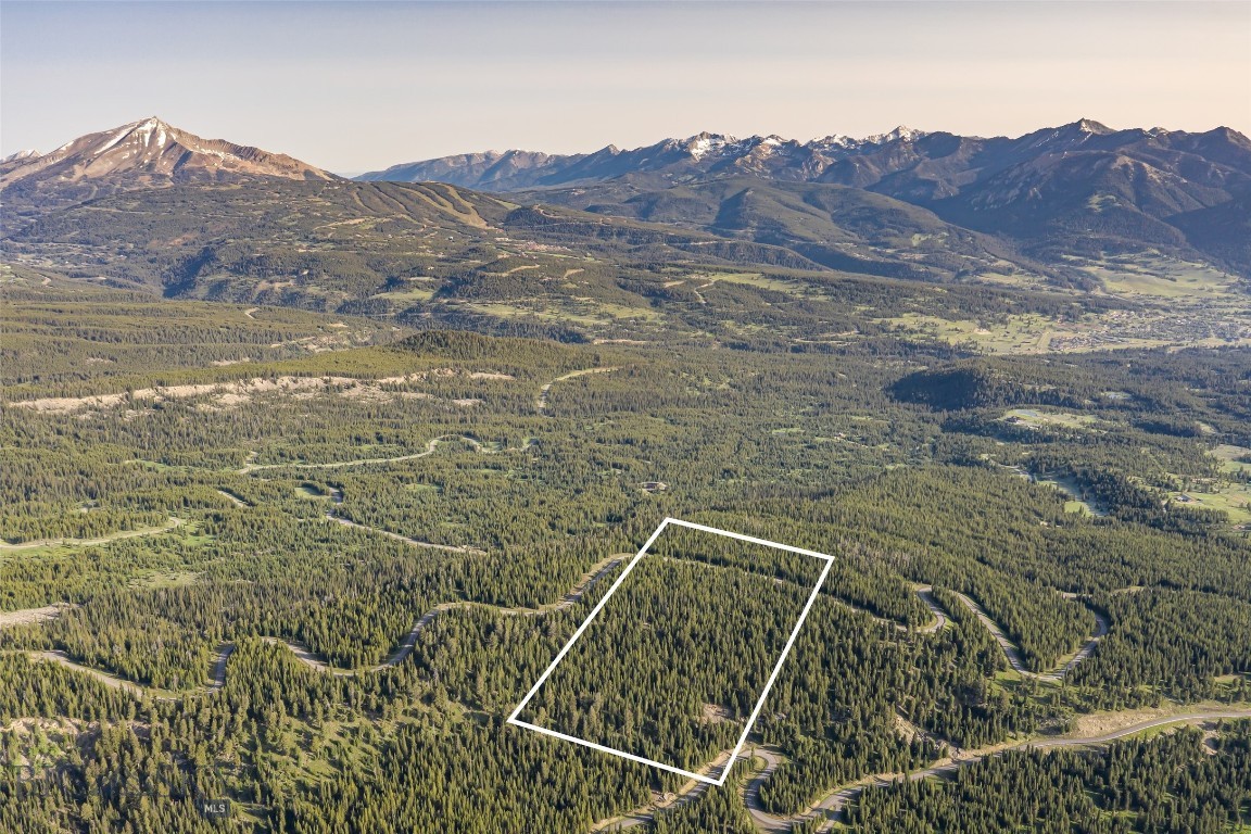 Discover the Pinnacle of Refined Mountain Living at Big EZ Estates – Lot 29
Nestled within the exclusive Big EZ Estates, Lot 29 offers an extraordinary 20-acre sanctuary, providing the ultimate blend of privacy, luxury, and natural beauty. This rare parcel is conveniently located just minutes from the heart of Big Sky Town Center, with paved road access and secure, gated entry, ensuring both privacy and convenience to neighboring private clubs Yellowstone Club and Spanish Peaks Mountain Club and minutes to the restaurants and shopping, farmers markets, concert series and rodeo in the Big Sky Town Center and 25 minutes to world class amenities of Big Sky Ski & Summer Resort.
Embrace awe-inspiring panoramic views of Lone Peak, Pioneer Mountain, and the iconic Spanish Peaks, where the landscape stretches in every direction to offer a visual masterpiece at every turn. Whether you’re imagining a serene private residence or an exceptional mountain retreat, this stunning lot serves as the perfect canvas for your Montana dream home.
At Big EZ Estates, exclusivity and tranquility come together in a community that celebrates both expansive natural landscapes and refined mountain living. With access to coveted amenities and a location that balances privacy with convenience, this property offers an unparalleled opportunity to craft your own legacy in one of the most sought-after areas of Big Sky.
Don’t miss the rare chance to own a piece of Big Sky’s most coveted and private enclave. Schedule your exclusive tour today and step into the epitome of mountain luxury living.
