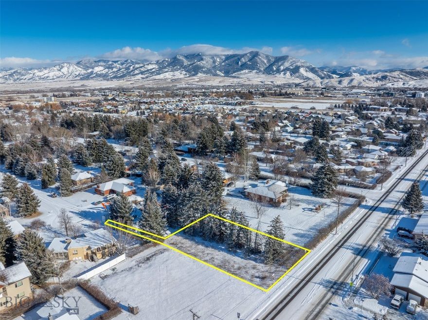 Build your next home in a centrally located Bozeman setting that supports an easy, connected lifestyle. Situated on a 0.34-acre parcel near the end of a cul-de-sac in Maple Terrace, this lot offers a rare blend of in-town convenience and usable space. At approximately 14,900 square feet, it is notably larger than many homesites in newer subdivisions, allowing room for a more comfortable layout, outdoor living, and thoughtful landscaping. With paved access, mature trees, city utilities available in the area, recorded access via a 12-foot easement, and water rights for irrigation, this parcel offers a compelling mix of location, scale, and potential. Grocery stores, restaurants, schools, daycare, parks, and daily services are all nearby. Buyer to verify all zoning, utility, access, and water right information.