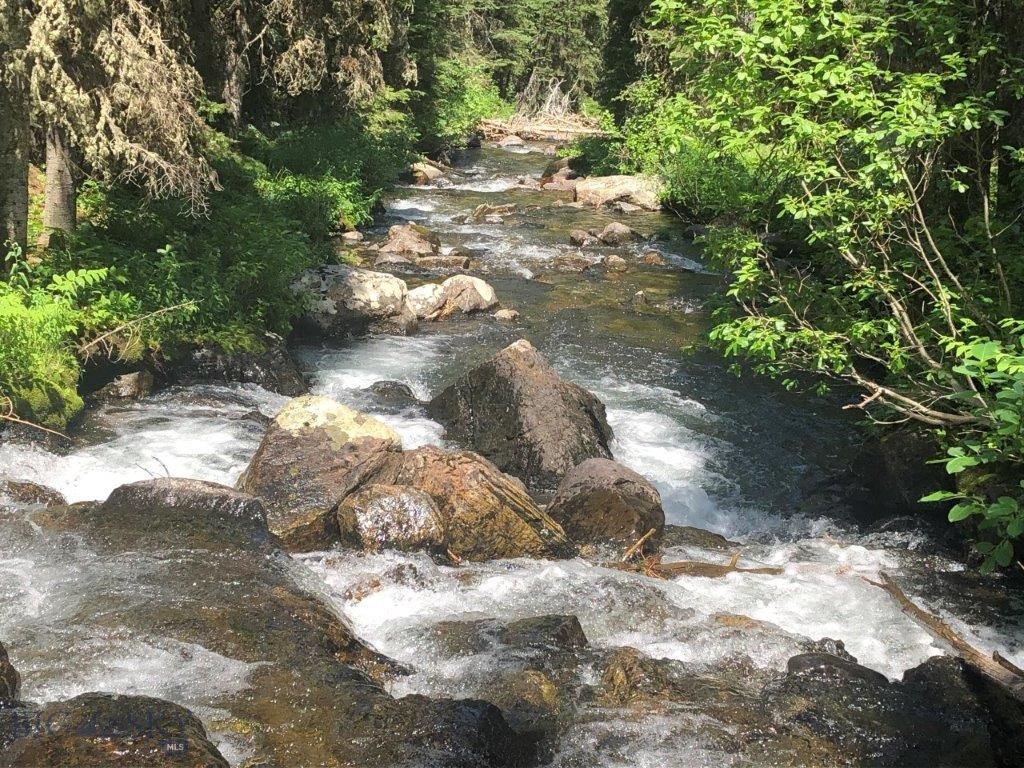 South Boulder River frontage in the heart of the Tobacco Root Mountains bordering National Forest land with a leveled cabin site already installed, fishing beyond compare, hunting, and mountain views you must see to believe. This is an EXTREMELY RARE property right on the banks of the South Boulder River; it’s ready to start building, or bring your camper!! It can’t be stressed enough how incredible it is to find this unique opportunity to own property right out in the heart of the Tobacco Root Mountains, which border tens of thousands of acres of National Forest lands. The Tobacco Root Mountains provide a mecca of recreation from its renowned fishing on the South Boulder River and all its pristine high mountain lakes to hiking the hundreds of miles of trails, to ATVing the jeep roads, to wildlife sightseeing and hunting, to climbing the mountain peaks and everything in between. The area has it all, and owning this fantastic property will put every bit of it right at the back door of the cabin in the mountains you always wanted to build. You’ll want to order a copy of the Beaverhead-Deerlodge National Forest – Central map to plan your days and weeks of hiking, fishing, hunting, biking, and ATVing. The Montana mountain wildflowers here are phenomenal, too. There’s so much to see and enjoy. The views are breathtaking, and the setting is one you’ll have to see and experience to believe. Build your cabin right near the edge of the South Boulder River, where you can see the river easily access the tumbling waters and hear the sounds of mother nature pouring by 24 hours a day/7, days a week. Or, for now, pull your camper in or put up your tent and start enjoying this amazing setting right away. You can fish for cutthroat and brook trout right in the river on your very own property, then go up and down the river onto all the National Forest lands and keep right on fishing. The river pours out of numerous high mountain lakes chock full of trout. Lakes like Brannan Lake, Sailor Lake, Lake Louise, Lost Cabin Lake, Globe Lake, and more are here to be fished and enjoyed. These are pristine and picturesque high mountain lakes with mountain peaks jutting up right from their shores. It’s the perfect background setting for your high mountain South Boulder River recreational property. The property also has a fresh Montana mountain stream and river running right through it.