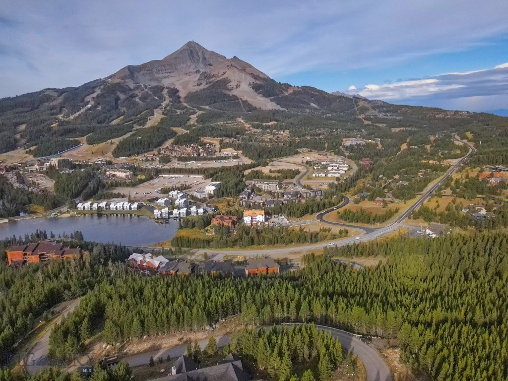 Build your dream home on this premier 2.52-acre lot in the exclusive gated community of Summit View. Perched high above Big Sky, this property offers sweeping, unobstructed views of the iconic Lone Peak and the Big Sky Resort slopes. With bold mountain vistas in every direction, the setting captures the essence of Montana’s alpine beauty.
South-facing exposure ensures year-round sunshine, natural warmth, and dramatic alpenglow evenings. The generous acreage provides both privacy and space, with ample room for designing a legacy mountain retreat. Nestled within a secure, gated neighborhood, the property offers peace and exclusivity while remaining conveniently close to the resort village, skiing, hiking, and all the outdoor recreation Big Sky is known for.
This Summit View lot combines privacy, panoramic views, and prime location—an exceptional opportunity to create a home in one of Big Sky’s most desirable settings.