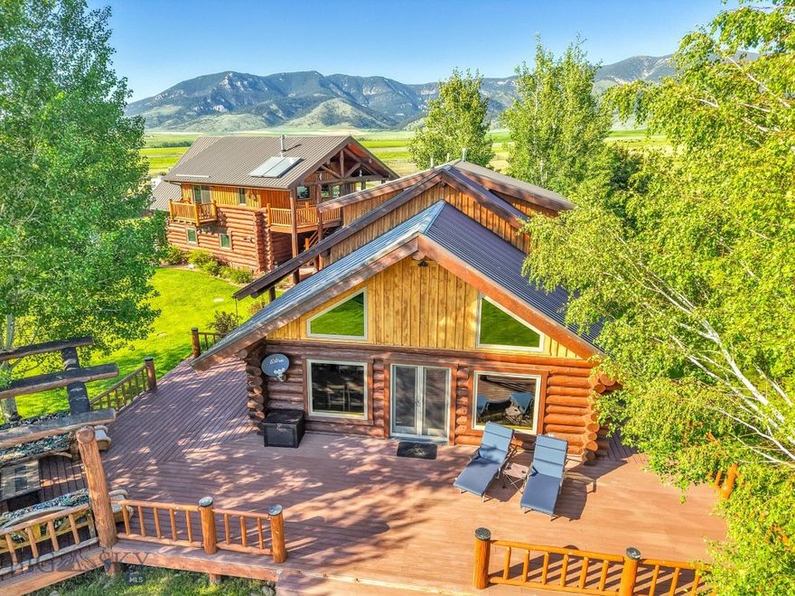 Horse property! Where rural Montana charm meets elegance! Gorgeous custom log home with 360 degree mountain views;  Spanish Peaks, Tobacco Roots, Horseshoe Hills, & the Bridger Range. Open floor plan concept of living, dining room, & kitchen open to a large wrap around deck & entertaining area. 4 bd, 2.5 ba, main level primary suite, laundry room, & office. Claw foot tub/ tiled showers. Oversized 2 car garage with a studio guest house with full bath & kitchenette/wet bar that utilizes solar panels. The 20 acres is fenced & crossed fenced with steel. Barn, tack room, & dog kennels. 90’ x 140’ riding arena done in steel. 52’ x 65’ maintenance free shop with steel siding & a steel roof, insulated & heated.  There is an art studio, gym, loft storage, & plenty of room for vehicles & toys. Cabin with outdoor cooking, sitting room, & fire pit for all of your outdoor entertaining. Beautifully manicured yard with beautiful mature trees & greenhouse. 16 mi from Bozeman Yellowstone Int. Airport.
