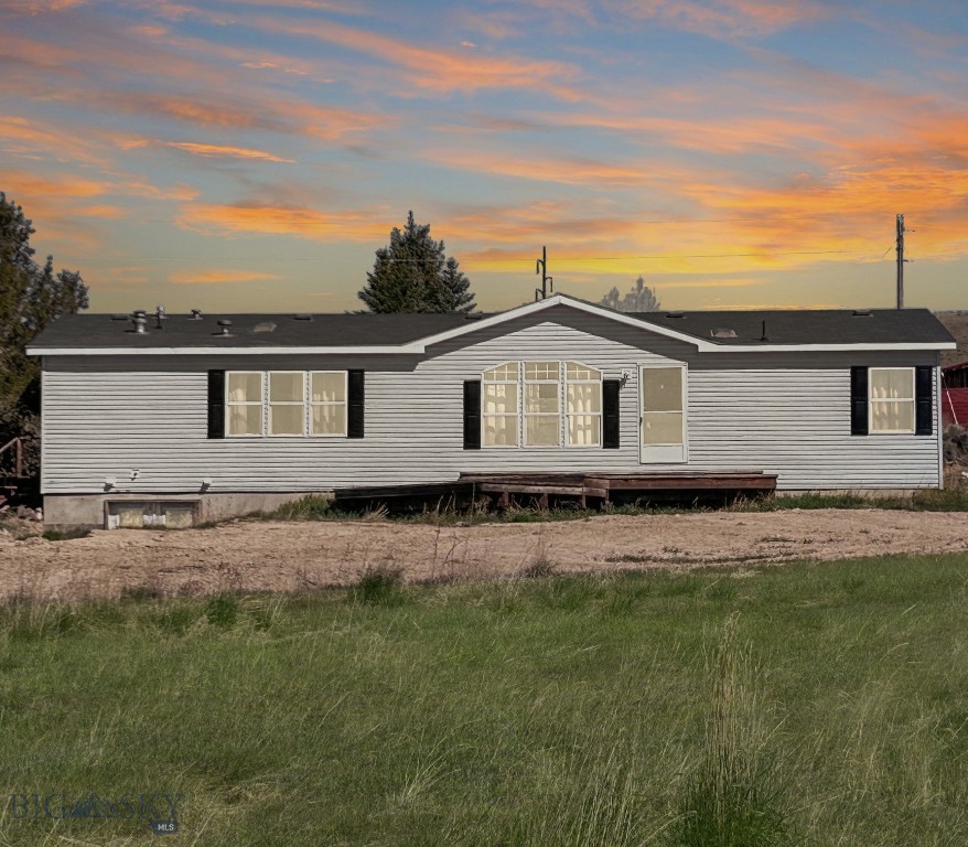 Experience the charm of small town living in Dillon, MT where this charming modular home featuring a spacious layout with 3 bedrooms and 2 bathrooms on 1.9 acres awaits you. The home comes with a full unfinished basement, a blank canvas where the possibilities are endless. This home truly blends comfort and convenience, close to town yet country feel. The open floor plan and vaulted ceiling with the kitchen, dining and family room creates an inviting space for gatherings and entertaining. The kitchen features a bar area,
range, dishwasher, refrigerator along with a nice desk area. Nice dining area between living room and family room. Slider off the family room opens up to the back yard for more entertaining space. Enjoy to big family room with big windows letting in lots of natural light and views of town. Master Suite features a big bathroom with soaker tub, shower, and walk-in closet. Two guest bedrooms, guest bath and laundry room round out the house. Outside, there are no covenants to restrict your use of the property. The property includes storage sheds and an authentic man cave, providing additional space for hobbies, storage, or entertainment. Short drive to all Dillon has to offer and minutes away from endless outdoor activities. Schedule your showing today!