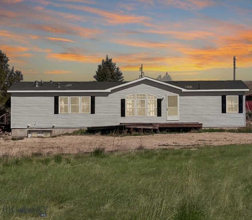 Experience the charm of small town living in Dillon, MT where this charming modular home featuring a spacious layout with 3 bedrooms and 2 bathrooms on 1.9 acres awaits you. The home comes with a full unfinished basement, a blank canvas where the possibilities are endless. This home truly blends comfort and convenience, close to town yet country feel. The open floor plan and vaulted ceiling with the kitchen, dining and family room creates an inviting space for gatherings and entertaining. The kitchen features a bar area, 
range, dishwasher, refrigerator along with a nice desk area.  Nice dining area between living room and family room. Slider off the family room opens up to the back yard for more entertaining space. Enjoy to big family room with big windows letting in lots of natural light and views of town. Master Suite features a big bathroom with soaker tub, shower, and walk-in closet. Two guest bedrooms, guest bath and laundry room round out the house. Outside, there are no covenants to restrict your use of the property. The property includes storage sheds and an authentic man cave, providing additional space for hobbies, storage, or entertainment. Short drive to all Dillon has to offer and minutes away from endless outdoor activities. Schedule your showing today!