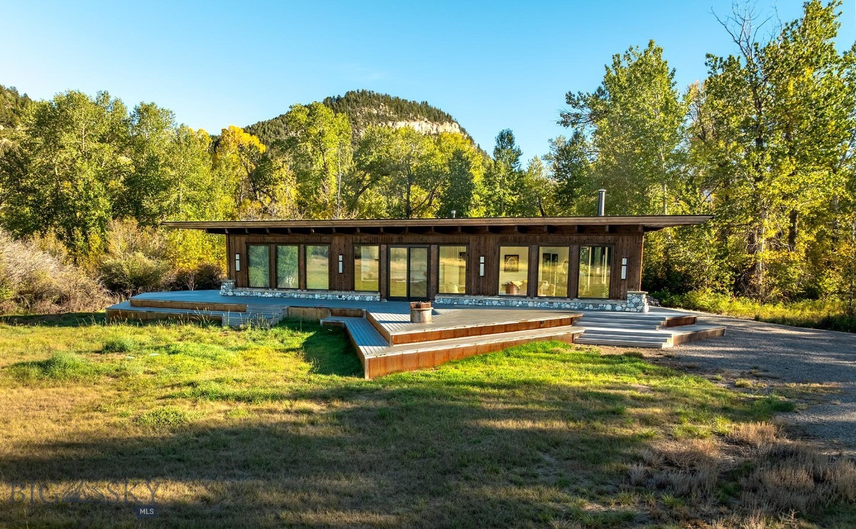 The Montana River Retreat may be the most attractive fly-angling property available in Montana today due to its extremely coveted Boulder River frontage and its thoughtfully designed mountain modern home already in place and waiting for a new owner to instantly enjoy.
The most significant and finite asset of this property lies in its abundance of water and exceptional angling opportunities. Spanning nearly half a mile, the pristine Boulder River flows alongside the property, offering deeded access to a world-class fishery. Renowned for its fast-moving, cold, and crystal-clear waters, the Boulder River is home to a robust population of both brown and rainbow trout. In addition to the river, the property features four spring-fed ponds, with one boasting large brown trout, as well as a spring-fed stream that meanders for approximately 2,500 feet. Together, these features not only enhance the property's aesthetic appeal but also hold the potential for further enhancement to optimize the aquatic experience.
Before building the current home on the property, the owners spent many evenings camping under the stars on the property, enjoying the sounds of the river and the beautiful setting of the property within the cottonwood meadows and captivating views. As they considered the construction of the beautiful home that sits on the property today, they wanted to keep that natural feel of camping under the stars as a vision for the construction. The end result is a beautiful 2,000± square foot triangle-shaped home that maximizes views at all angles, providing the ultimate indoor and outdoor experience.
The Boulder River Valley is one of the most highly sought-after destinations in Montana, celebrated for its quintessential Montana scenery and the charming small-town atmosphere of Big Timber, Montana. This property is conveniently located just 25 minutes from Big Timber and a short drive of approximately 1 hour and 25 minutes from Bozeman, which offers world-class amenities and an international airport.