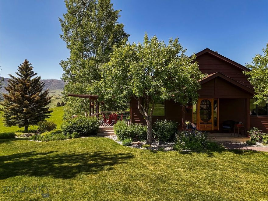 Welcome to 585 Bridger Woods—an inviting 3,088 sq. ft. home set on 25 pristine acres in the heart of Bridger Canyon. Just 15 minutes from Bridger Bowl Ski Area, Crosscut Mountain Sports Complex, and downtown Bozeman, this property offers the perfect balance of privacy and convenience. Originally built in 1992 and expanded and renovated in 2002, this home features a warm and inviting open-concept design. The spacious main living area is open with kitchen, dining, and living room, creating an ideal space for entertaining or relaxing. A gas fireplace anchors the living room, while large picture windows perfectly frame the views of the Bridger Mountain range.
The home features three bedrooms plus a versatile bonus room, with a main-level primary suite for easy living. Step outside onto the brand-new deck and take in the expansive scenery—perfect for enjoying Montana’s stunning sunrises and wildlife. In addition to the 2-car attached garage, the property includes a detached two-car shop with generous storage and a dedicated craft studio and screened porch, offering endless possibilities for hobbies or gear storage. Experience the best of mountain living with skiing, hiking, and outdoor recreation at your doorstep, all while being just minutes from the vibrant culture, dining, and shopping of downtown Bozeman.