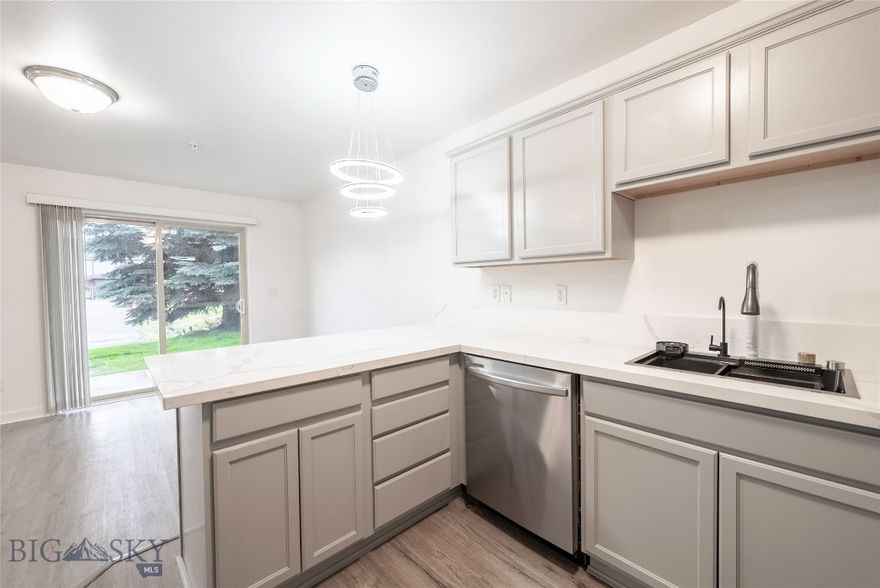 Step into this beautifully updated Belgrade condo, where modern touches meet everyday comfort. Fresh paint, new flooring, and stylish finishes throughout create a bright and welcoming feel from the moment you walk in. The kitchen shines with brand new appliances and sleek countertops, while the bathrooms feature updated vanities and glass shower panels for a clean, contemporary look. Enjoy the convenience of a private garage, brand new blinds, and a new sliding patio door that leads to a cozy outdoor space. Perfectly located near local schools, parks, shopping, and just a short drive to Bozeman or the airport, this home is ideal for anyone looking to settle into the heart of the Gallatin Valley.