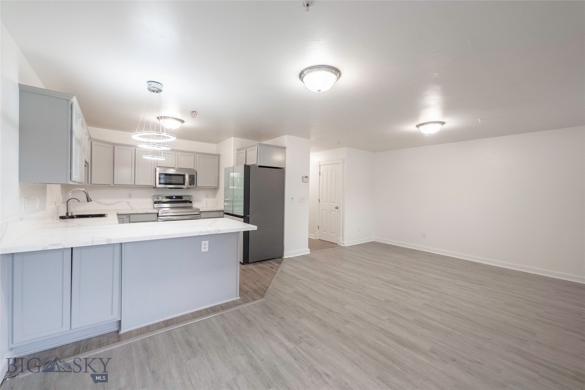 Step into this beautifully updated Belgrade condo, where modern touches meet everyday comfort. Fresh paint, new flooring, and stylish finishes throughout create a bright and welcoming feel from the moment you walk in. The kitchen shines with brand new appliances and sleek countertops, while the bathrooms feature updated vanities and glass shower panels for a clean, contemporary look. Enjoy the convenience of a private garage, brand new blinds, and a new sliding patio door that leads to a cozy outdoor space. Perfectly located near local schools, parks, shopping, and just a short drive to Bozeman or the airport, this home is ideal for anyone looking to settle into the heart of the Gallatin Valley.