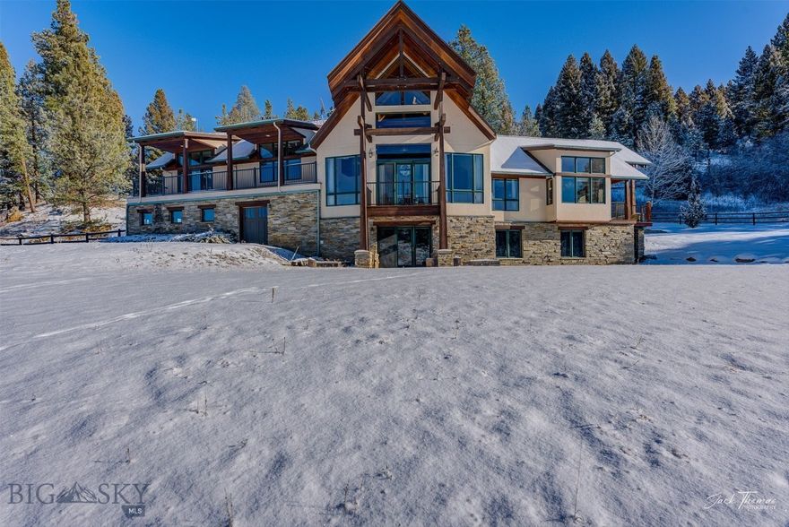 Surrounded by mountains, sweeping meadows, and the quiet rhythm of a clear mountain creek, this remarkable estate offers a rare opportunity to own a sanctuary bordering the protected lands of the United States Forest Service. Here, privacy and wilderness meet refined design. The custom timber-frame residence blends timeless craftsmanship with modern luxury. Exposed beams rise above grand living spaces anchored by dramatic stone fireplaces, while expansive windows frame breathtaking mountain views in every direction. The 388 acre property unfolds across rolling alpine meadows and mature forest, with a year-round creek winding through the land. Wildlife passes regularly through the open pasture and timber, creating a setting that feels both secluded and deeply connected to nature. Thoughtfully designed for comfort, recreation, and legacy ownership, the estate includes: • A beautifully crafted timber frame home with panoramic mountain views • Multiple stone fireplaces creating warm gathering spaces • A private sauna retreat for relaxation after days outdoors • Classic barn and outbuildings ideal for horses, equipment, or animal care • Expansive meadows and forested acreage • Direct access to thousands of acres of protected wilderness Step outside your door to ride, hike, ski, or explore endless trails across neighboring public lands. Situated in the coveted 380 hunting district, the elk and deer hunting is world class. Evenings are best spent on the terrace watching alpenglow settle across the mountains before retreating inside to the warmth of firelight beneath soaring timber beams. Properties of this caliber—combining craftsmanship, natural beauty, and direct wilderness access—rarely become available. This is more than a home. It is a mountain legacy property meant to be experienced, shared, and passed forward.